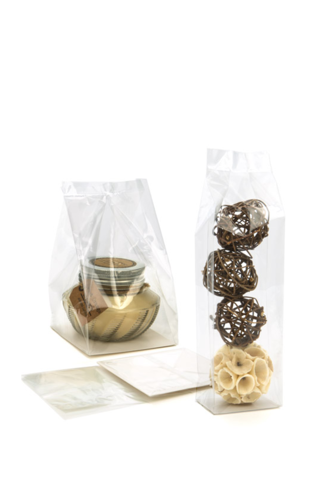 A block bottom bag standing upright next to a pinch bottom bag lying flat.